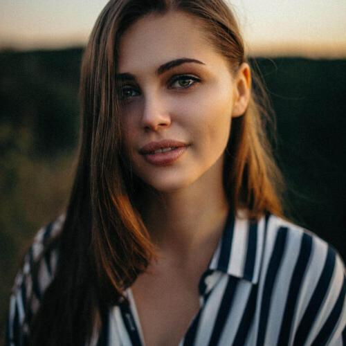 close up photo  woman with black and white stripes top